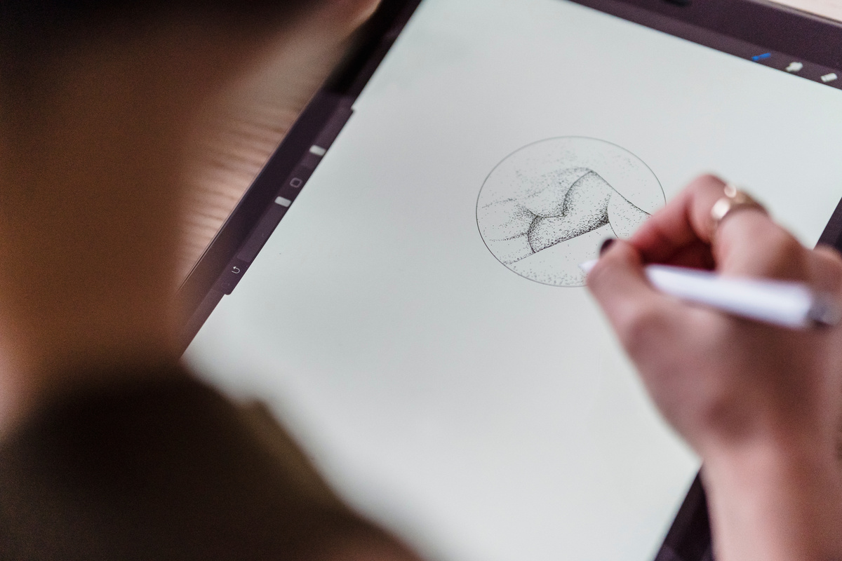 Unrecognizable artist drawing creative sketch
